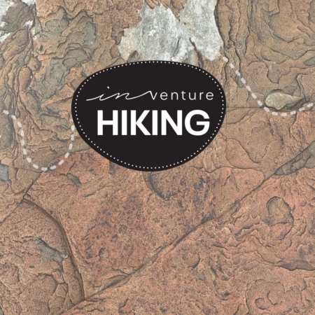 An image of a rock texture with the Hiking Logo on top