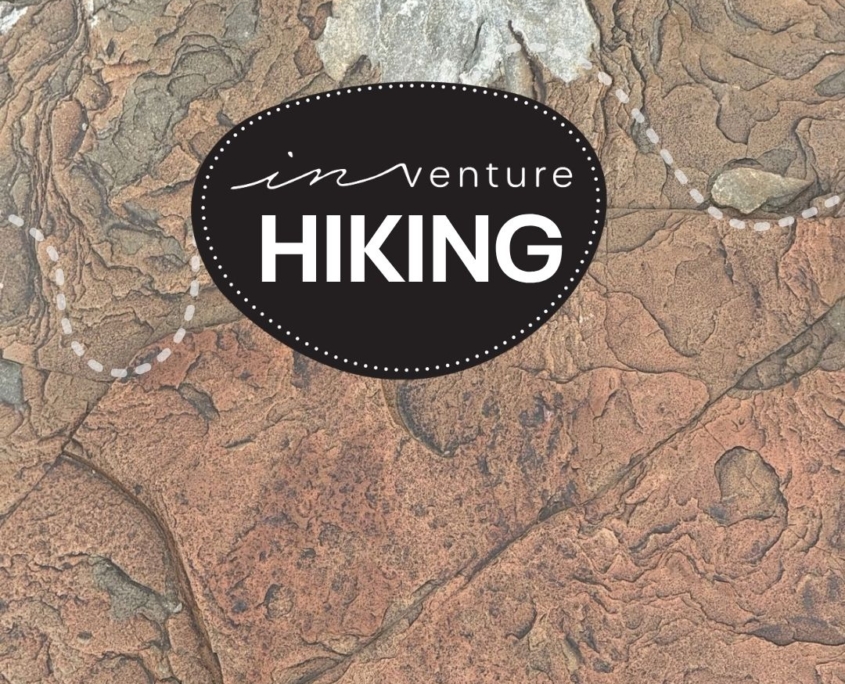 An image of a rock texture with the Hiking Logo on top